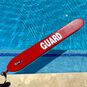 The Grip It Lifeguard Rescue Tube floating in a pool.