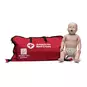 Prestan Infant Manikin with CPR Monitor sitting upright next to an American Red Cross carrying bag.